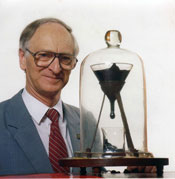 Professor John Mainstone with the Pitch Drop Experiment